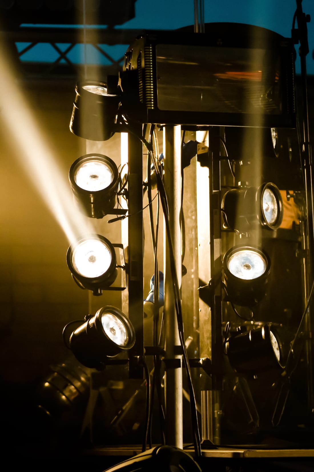 Lighting rig with beams cutting through haze